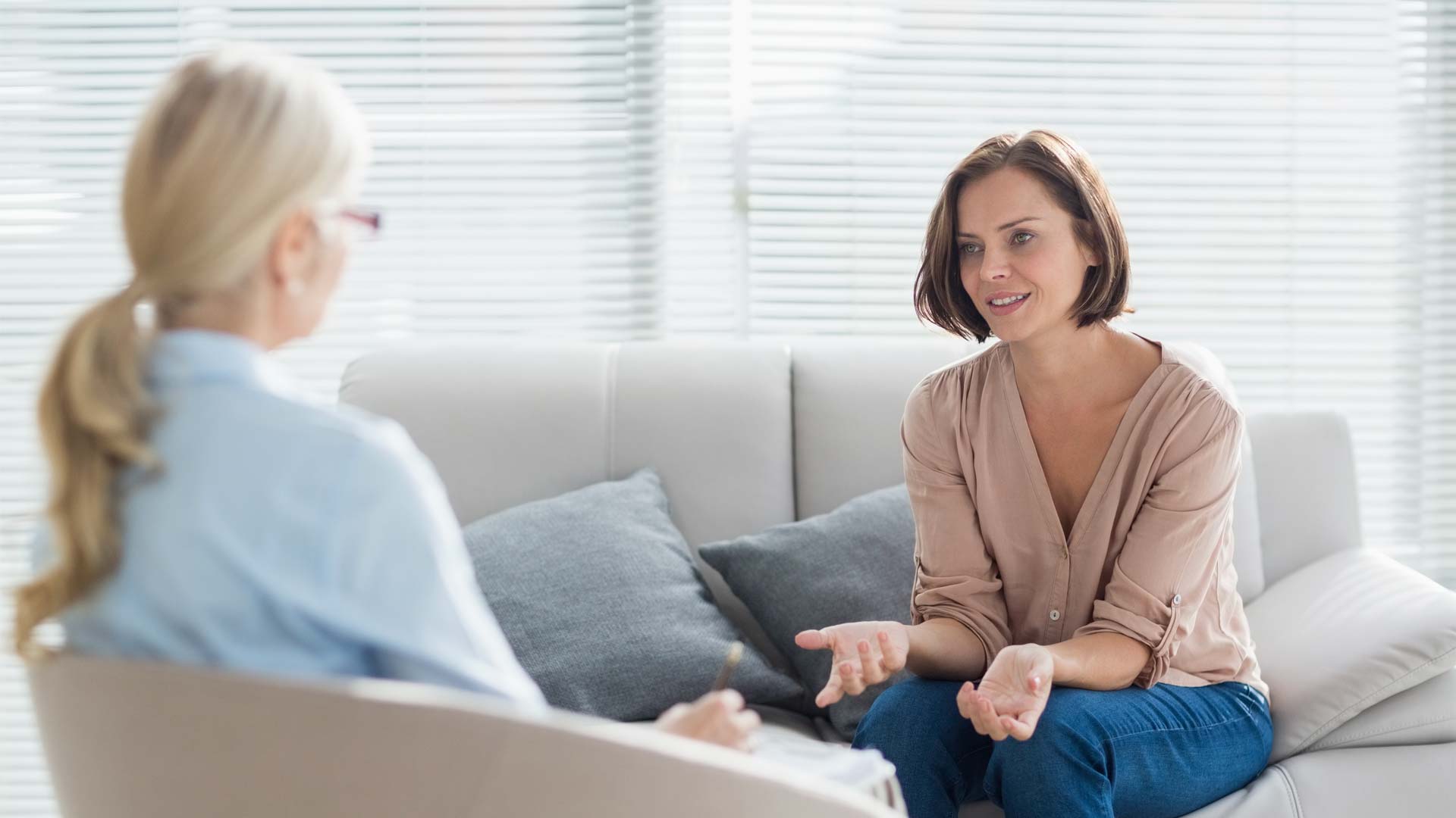Therapist talking to client