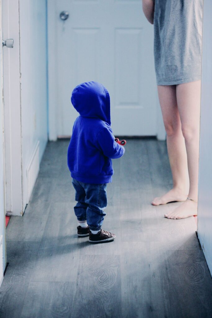 child looking up at parent