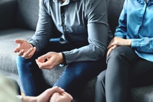 mediator or family counsel with couple in therapy meeting