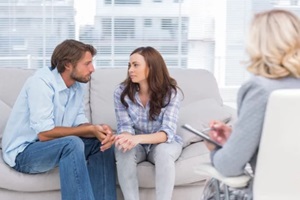 couple looking to each other during therapy session