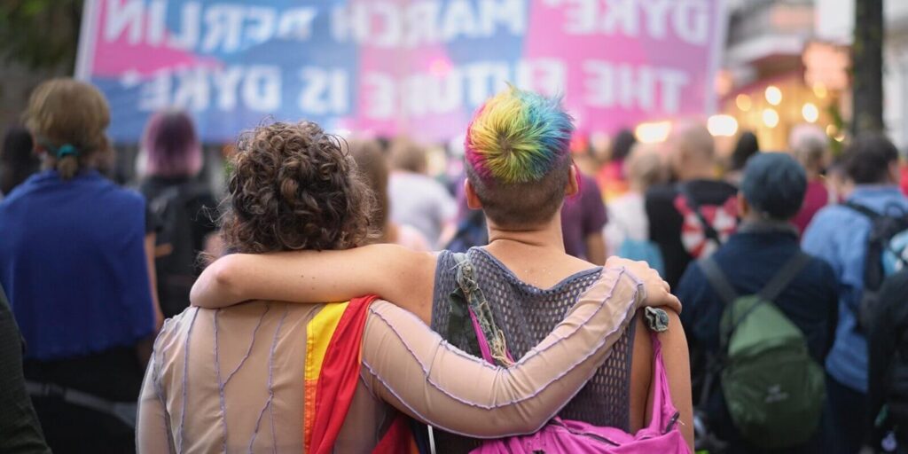 happy lesbian couple walk lgbt pride