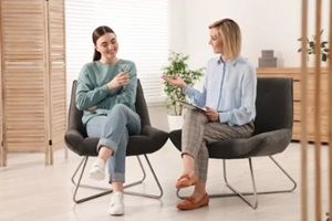 professional psychotherapist working with patient in office