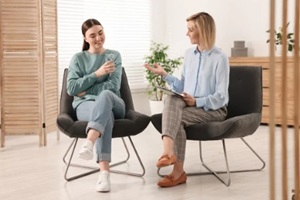 professional psychotherapist working with patient in office