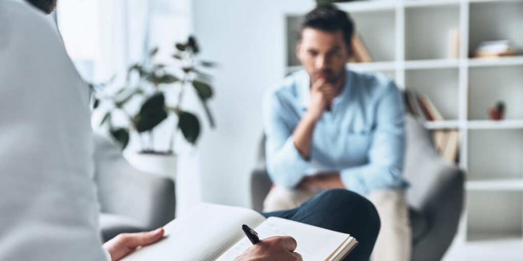 man sitting with a therapist