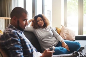 couple, separation or fight with argument on sofa for disagreement during couples therapy