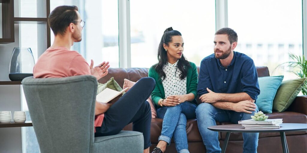 couple, relationship and marriage with therapy, office and discussion with communication, psychology and talking