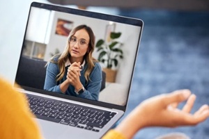 video call and therapy on laptop screen for support