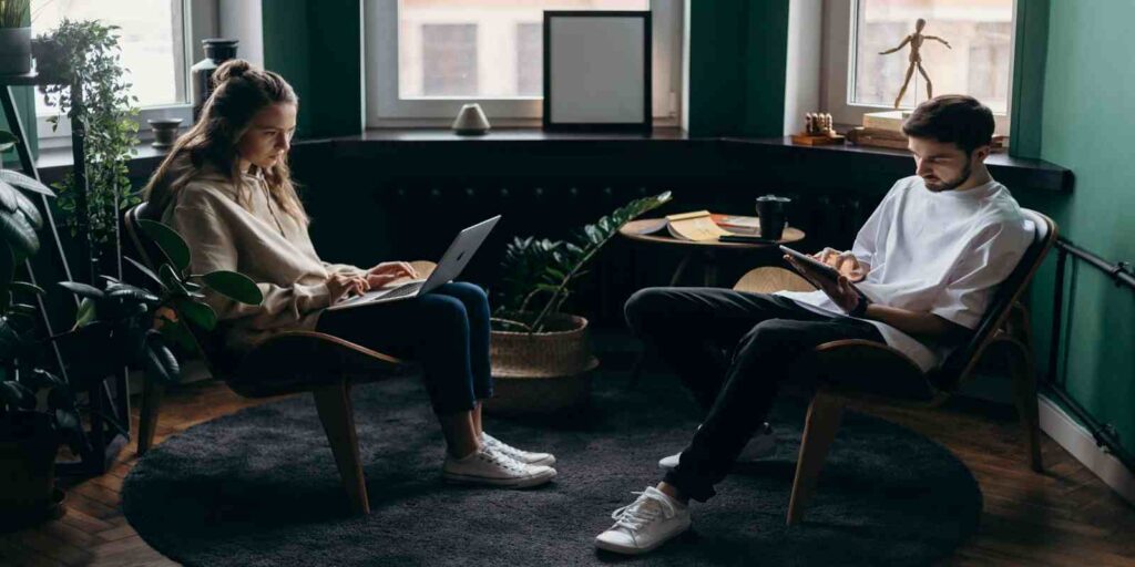 Couple Busy in Using Their Gadgets