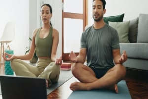 Couple Doing Meditation Through Online Class