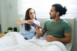 Couple Fighting about Social Media on Bed