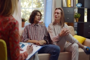 Unhappy Gay Couple Talking to A Therapist