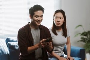 Woman Feeling Jealous Seeing Her Man Happy on Social Media