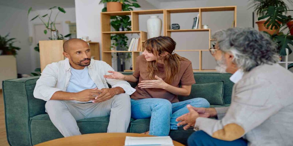 Young Couple Sitting Together in Front of Maryland Couple Therapist