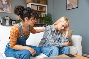 Young Gay Woman Talking with Her Girlfriend about Their Relationship Problems
