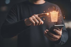 Fingertip Touching Digital Recycle Bin Representing Removing Unnecessary Apps