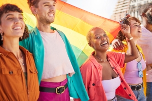 LGBT People Walking with Rainbow Flag to Support Trans Community