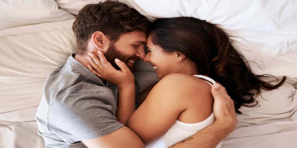 Romantic Couple Hug in Bed During Intimacy