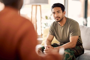 Stressed Man Talking to Therapist in Therapy Session