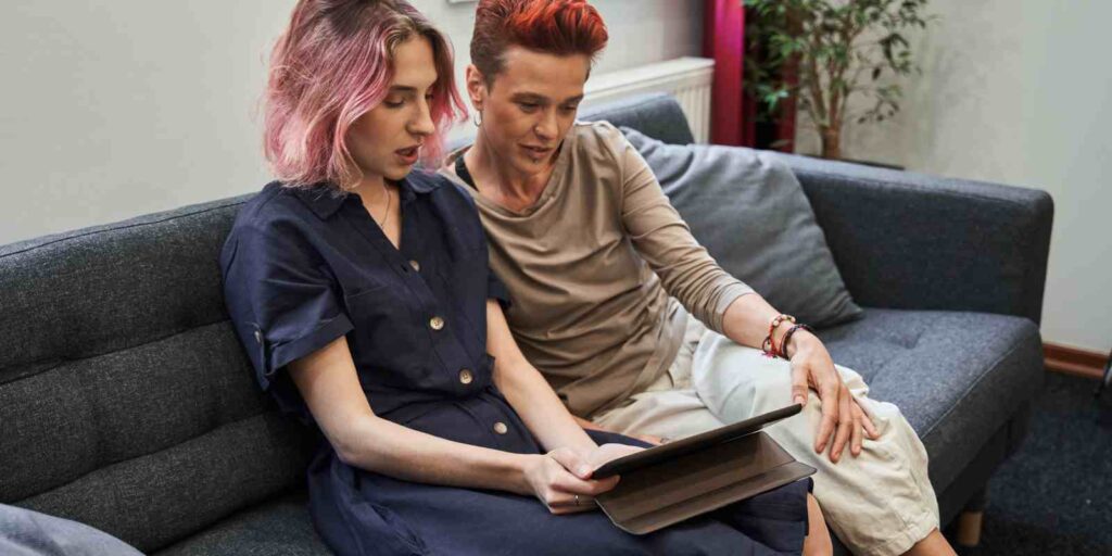 LGBTQ+ Couple Having Online Therapy on Tablet in Maryland