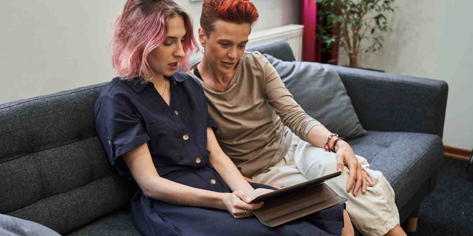 LGBTQ+ Couple Having Online Therapy on Tablet in Maryland