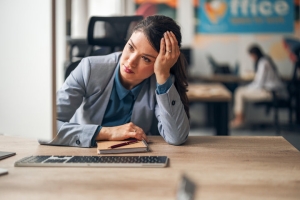 Female Professional Experiencing Burnout and Emotional Exhaustion at Corporate Office