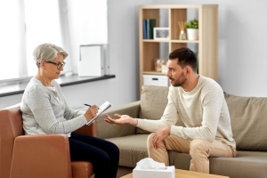 Man Explaining His Problems to A Senior Therapist in Maryland