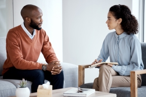 Man Talking about Gender Identity to A Therapist in Session