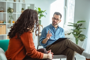 Therapist Guiding Female Patient in First Therapy Session