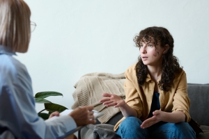 Young Female Discussing Her Issues with Therapist in Indivisual Therapy