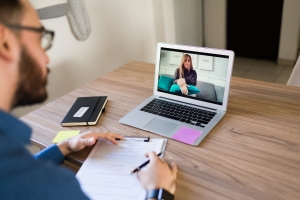 Psychologist Talking with a LGBTQ Patient in Online Therapy Session