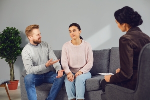 Couple in Therapy Session with Psychologist About Parent Differently
